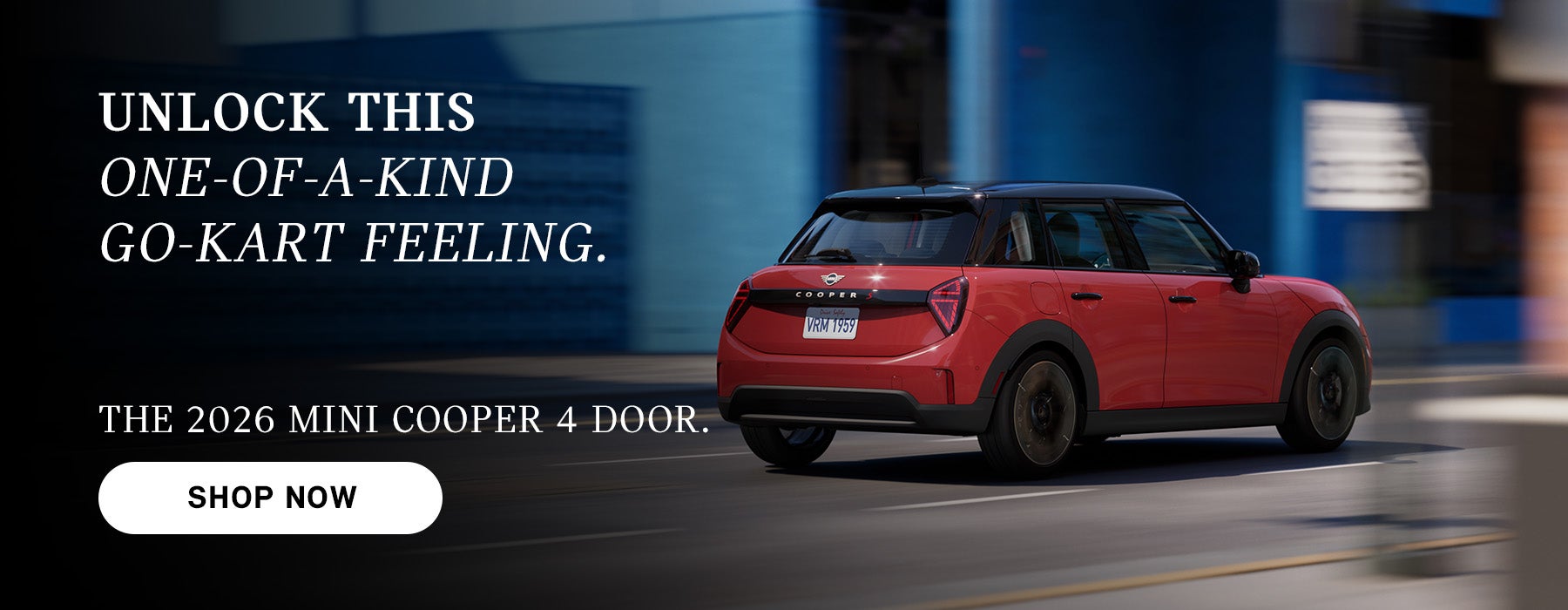 Red MINI Cooper 4-door driving on a city street, with motion blur in the background and ad text promoting the 2026 model