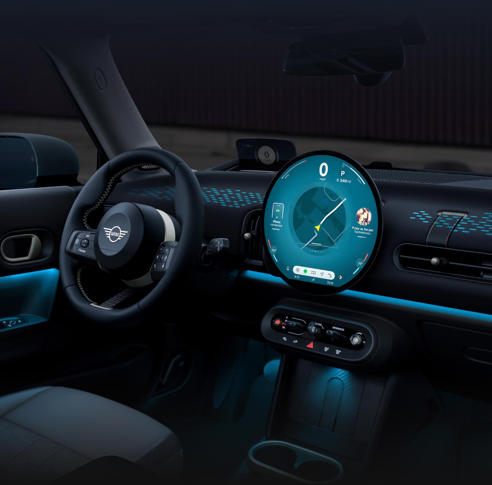 The glowing dashboard of the MINI Cooper 2 Door.