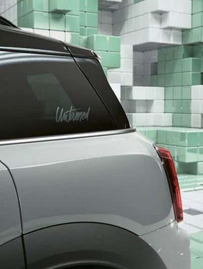 Closeup of the exclusive momentum grey metallic paint on a MINI Countryman Untamed Edition, in a CGI world made up of 3D, Tetrislike boxes.