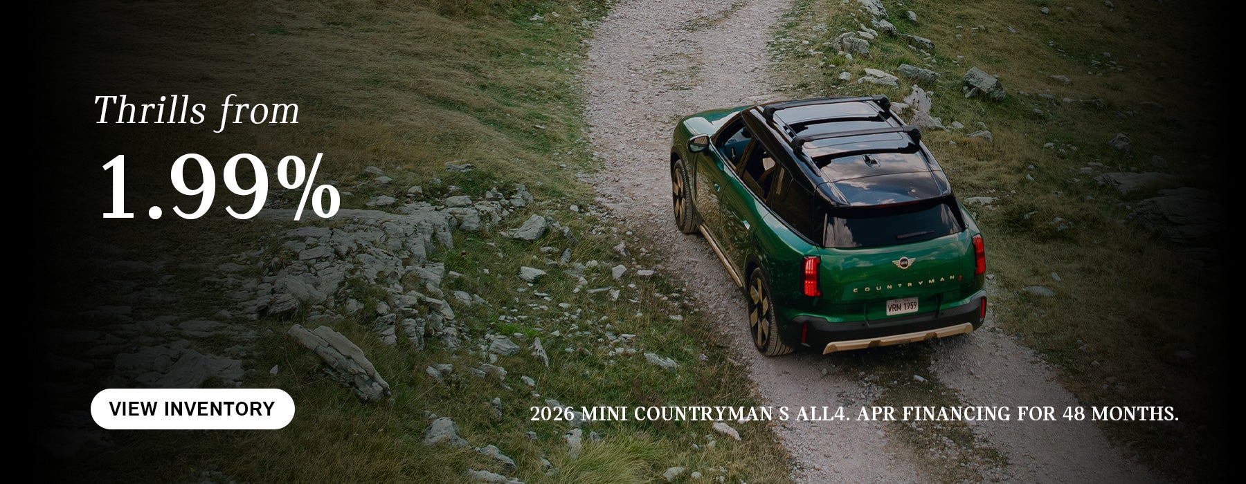 Green Countryman driving.