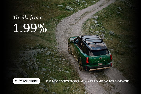 Green Countryman driving.