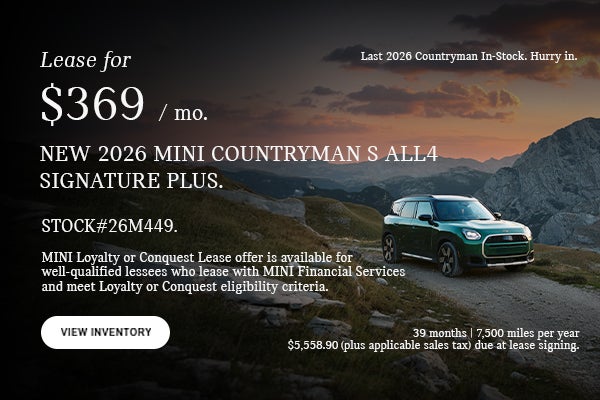 Green countryman parked.