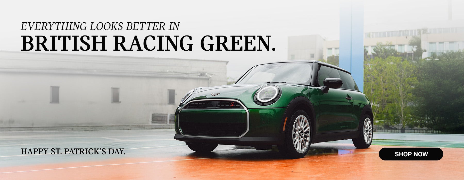 Green MINI parked.